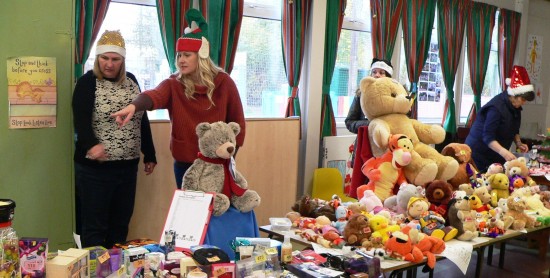 Volunteers get into the spirit as they set up stalls at last year's Christmas Bazaar
